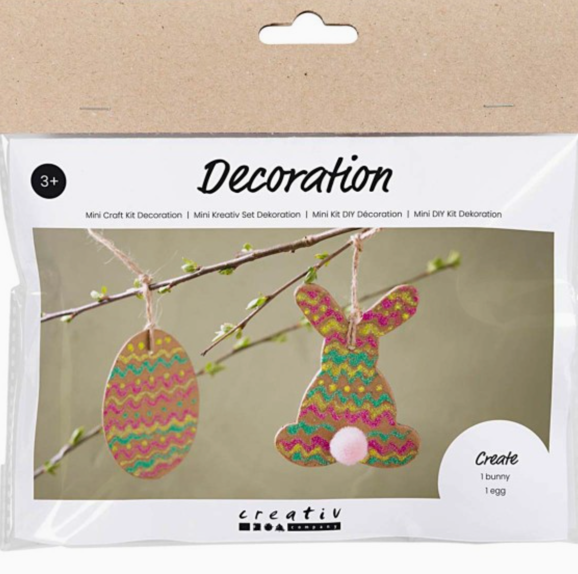 Ein verpacktes **Creativ Company - Oster-DIY-Set für Kinder - Ei und Hase** zum Erstellen von DIY-Osterdekorationen, ideal für Bastelbedarf für Kinder von **Creative Company**. Das Set enthält Materialien zum Herstellen eines Hasen- und eines Eierornaments, beide mit farbenfrohen, gewellten Mustern. Die Verpackung zeigt den fertigen Hasen und das Ei, die an Zweigen hängen. Geeignet für Kinder ab 3 Jahren.